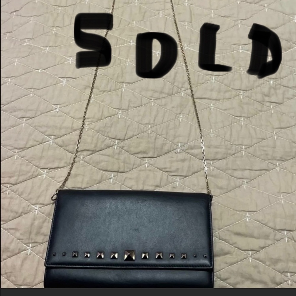 Authentic Valentino Garavani Rockstud wallet on a chain or crossbody bag.